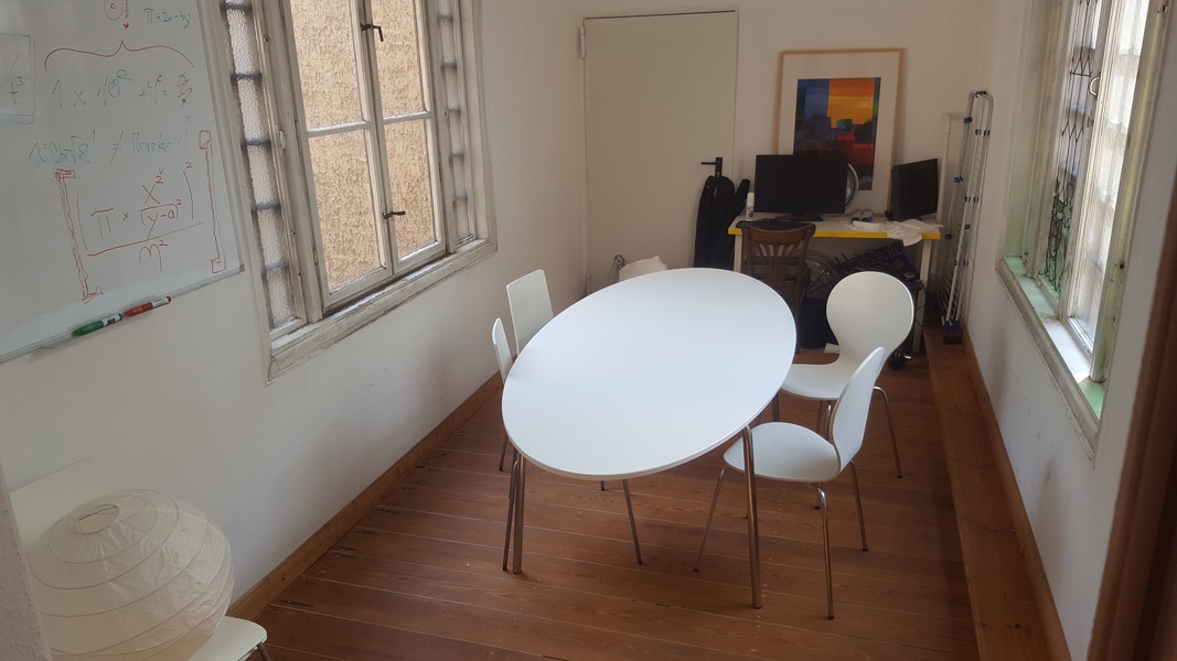 Furnished room in bigger office space (4 - 6 desks)